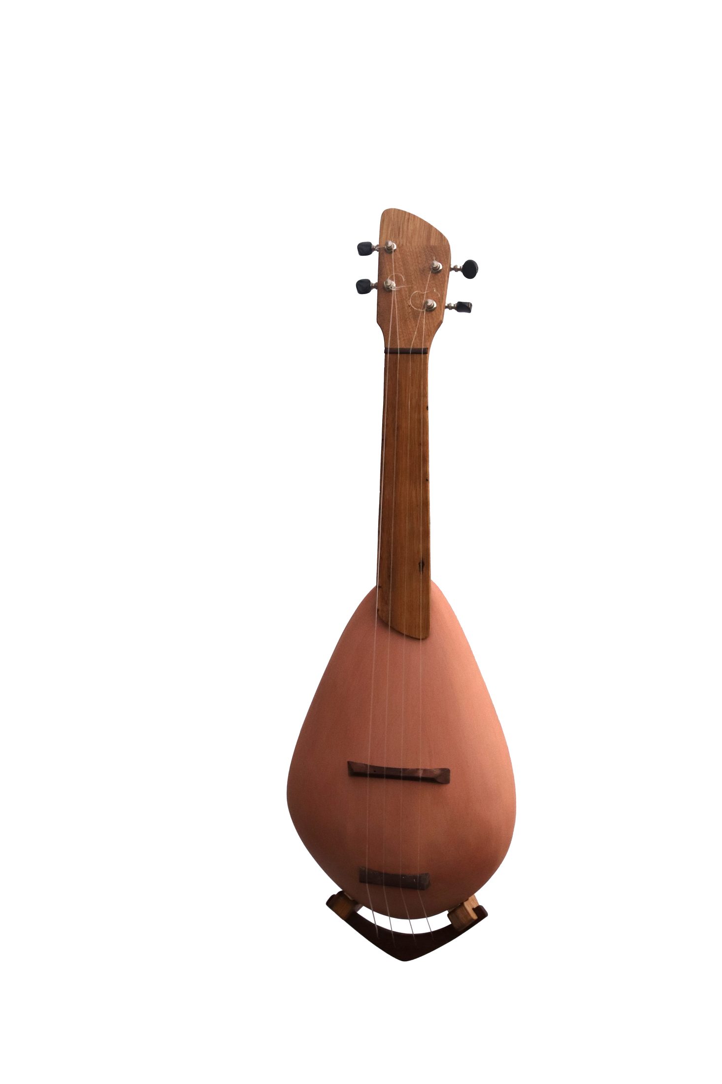 A ceramic ukulele on terracotta